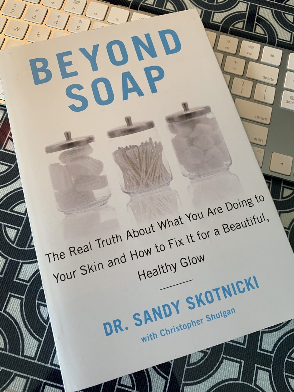 Photo of book, Beyond Soap - The Real Truth About What You Are Doing To Your skin and How to Fix It for a Beautiful Healthy Glow written by dermatologist Dr. Sandy Skotnicki